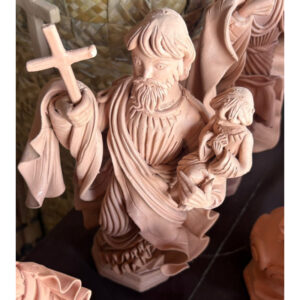 Handmade clay sculpture of Saint Joseph, Father of Jesus Christ, crafted by Olaria MN, featuring artisan Catholic religious art and Christian home decor. raffia objects home decor