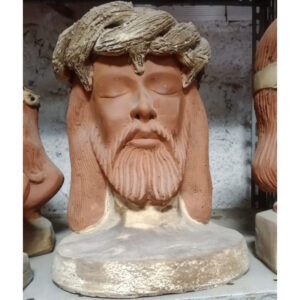 Handmade clay sculpture of the Face of Jesus Christ crafted by Pottery MN, featuring artisan Christian religious art and spiritual home decor.- raffia objects home decor